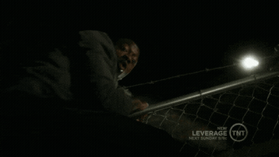 A Man Talking On A Cell Phone With The Words " What I 'M Busy " Above Him GIF