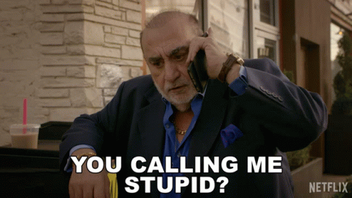 A Man Talking On A Cell Phone With The Words You Calling Me Stupid GIF