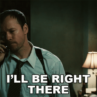 A Man Talking On A Phone With The Words I 'Ll Be Right There Written Below Him GIF