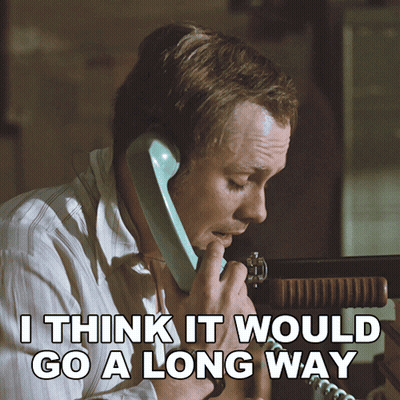 A Man Talking On A Phone With The Words " I Think It Would Go A Long Way " Above Him GIF