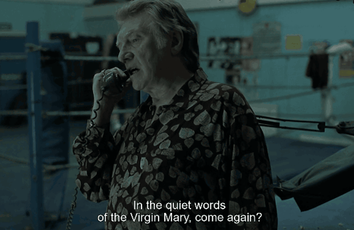 A Man Talking On A Phone With The Words " In The Quiet Words Of The Virgin Mary Come Again " GIF