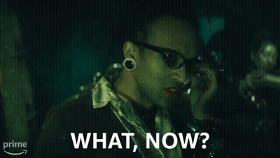 A Man Talking On A Phone With The Words What Now On The Bottom GIF