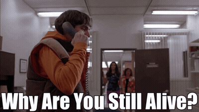 A Man Talking On A Phone With The Words Why Are You Still Alive GIF