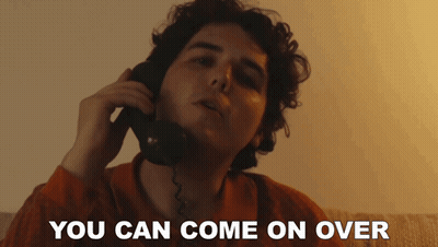 A Man Talking On A Phone With The Words " You Can Come On Over " Written Below Him GIF