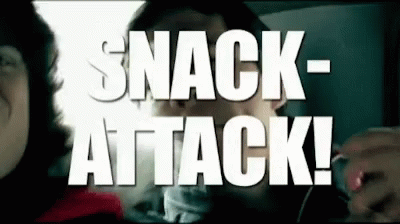 A Man Talking To A Woman In A Car With The Words Snack Attack Written On The Screen GIF