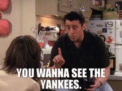 A Man Talking To A Woman In A Kitchen With The Words You Wanna See The Yankees On The Bottom GIF