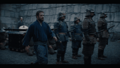 A Man Talking To A Woman With The Words Peering Into Ladies Private Quarters Below Him GIF