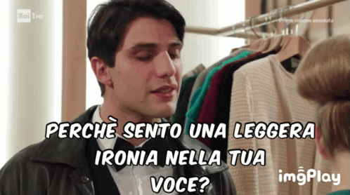 A Man Talking To A Woman With The Words Perche Sento Una Leggera Ironia Nella Tua Voce Behind Him GIF