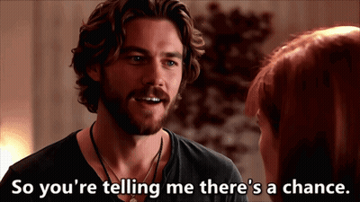 A Man Talking To A Woman With The Words So You 'Re Telling Me There 'S A Chance Written Below Him GIF