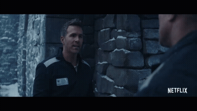 A Man Talking To Another Man With A Netflix Logo On The Bottom GIF