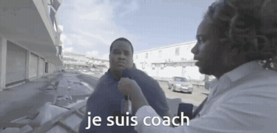 A Man Talking To Another Man With The Words Je Suis Coach On The Bottom Right GIF