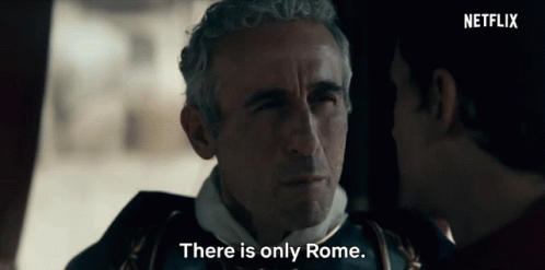 A Man Talking To Another Man With The Words " There Is Only Rome " GIF