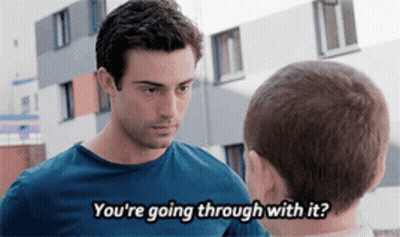A Man Talking To Another Man With The Words " You 'Re Going Through With It " Visible GIF