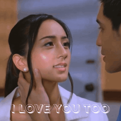A Man Touching A Woman 'S Face With The Words I Love You Too Below GIF
