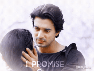A Man Touching A Woman 'S Face With The Words " I Promise " Below Him GIF
