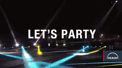 A Man Truck Is Driving Down The Road At Night GIF