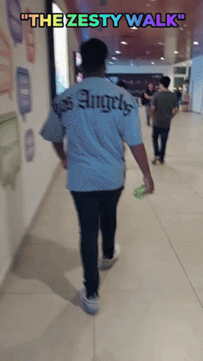 A Man Walking Down A Hallway With The Words " The Zesty Walk " Above Him GIF