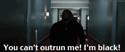 A Man Walking Down A Hallway With The Words " You Can 'T Outrun Me I 'M Black " On The Bottom GIF