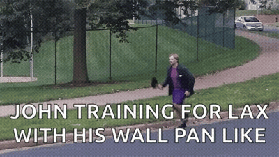 A Man Walking Down A Sidewalk With The Words " John Training For Lax With His Wall Pan Like " GIF