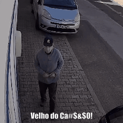 A Man Walking Down A Sidewalk With The Words Velho Do Ca # $ & $ Written Below Him GIF