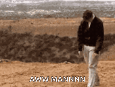 A Man Walking In The Desert With The Words Aww Mannn On The Bottom Right GIF