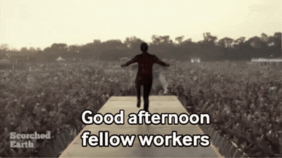 A Man Walking On A Stage With The Words Good Afternoon Fellow Workers GIF