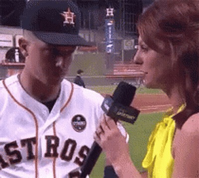 A Man Wearing A Astros Jersey Is Being Interviewed By A Woman GIF