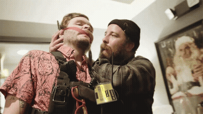 A Man Wearing A Badge That Says ' Ambulance ' On It GIF