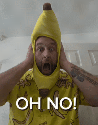 A Man Wearing A Banana Hat And A Shirt That Says Oh No On It GIF