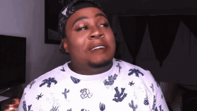 A Man Wearing A Bandana And A Cactus Shirt GIF