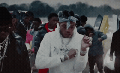 A Man Wearing A Bandana And A Hoodie That Says Baby On It GIF