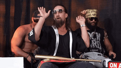 A Man Wearing A Bandana That Says Gang Is Holding A Baseball Bat GIF