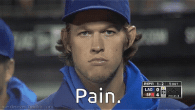 A Man Wearing A Baseball Cap And A Blue Shirt Says Pain GIF