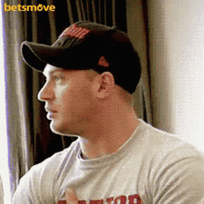 A Man Wearing A Baseball Cap And A T-Shirt With A Betsmove Logo GIF