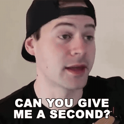A Man Wearing A Baseball Cap Is Asking If He Can Give Me A Second GIF