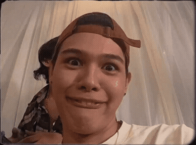 A Man Wearing A Baseball Cap Is Making A Face GIF