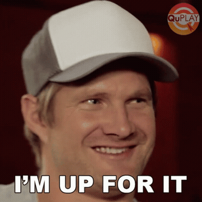 A Man Wearing A Baseball Cap Is Smiling And Says I 'M Up For It GIF