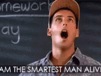A Man Wearing A Baseball Cap Is Standing In Front Of A Blackboard . GIF