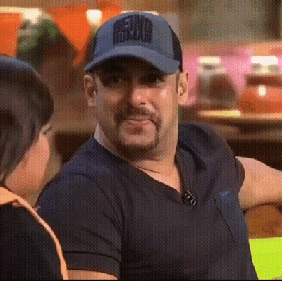 A Man Wearing A Baseball Cap That Says Being Human GIF