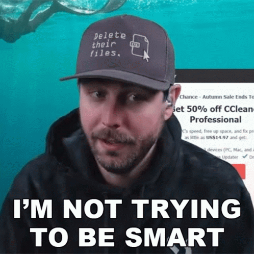 A Man Wearing A Baseball Cap That Says Delete Their Files GIF
