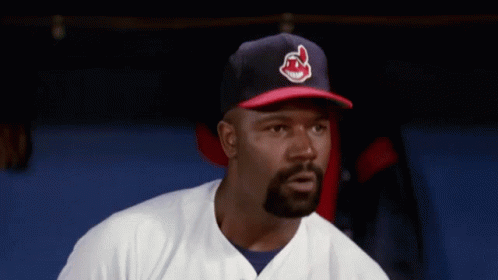 A Man Wearing A Baseball Cap With The Letter C On It GIF