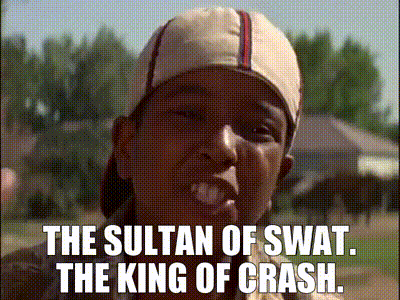 A Man Wearing A Baseball Cap With The Words The Sultan Of Swat The King Of Crash Written On It GIF