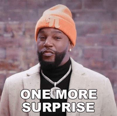 A Man Wearing A Beanie And A Jacket Says One More Surprise GIF