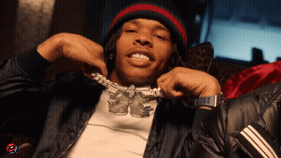 A Man Wearing A Beanie And A Necklace That Says ' Kc ' On It GIF