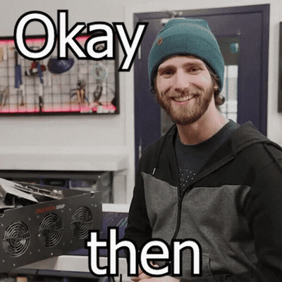 A Man Wearing A Beanie Is Smiling With The Words Okay Then Above Him GIF