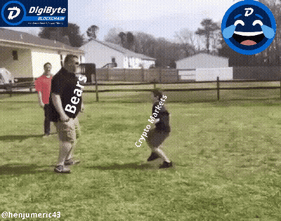 A Man Wearing A Bears Shirt Stands Next To A Boy Wearing A Crypto Market Shirt GIF