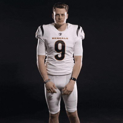 A Man Wearing A Bengals Jersey With The Number 9 GIF