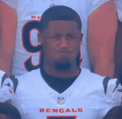 A Man Wearing A Bengals Jersey With The Number 9 On The Front GIF