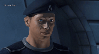 A Man Wearing A Beret With The Letter A On It Looks At The Camera GIF