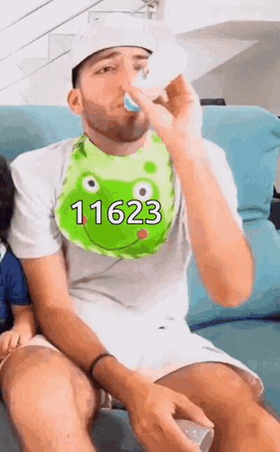 A Man Wearing A Bib That Says 11623 On It GIF